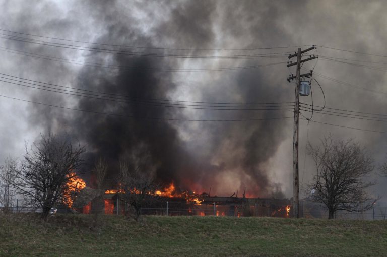 A fire burns at Park Medical Centers building in Detroit on Tuesday, April 9, 2013. Two people remain unaccounted for in the gutted medical office building after a possible shooting and intentionally set fire, police said. Detroit police homicide inspector Dwane Blackmon said one of the missing is believed to be a woman who worked at the center and the other is a man who entered the building with a gun. (AP Photo/Detroit Free Press, Steven Pepple) DETROIT NEWS OUT; NO SALES