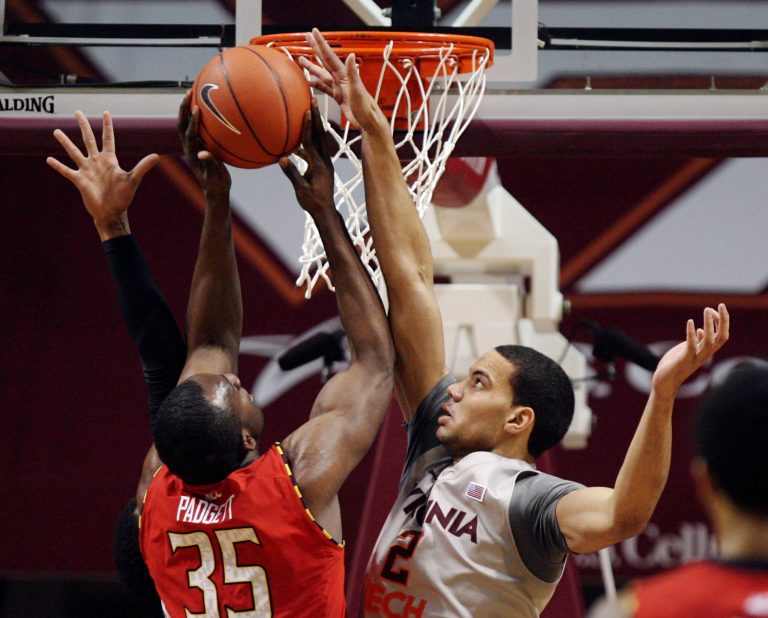 James Padgett (35) left, of Maryland shoots past the defense of Joey van Zegeren (2) right, of Virginia Tech during the first half of an NCAA college basketball game in Blacksburg, Va., Thursday Feb. 7 2013. (AP Photo / The Roanoke Times, Matt Gentry)