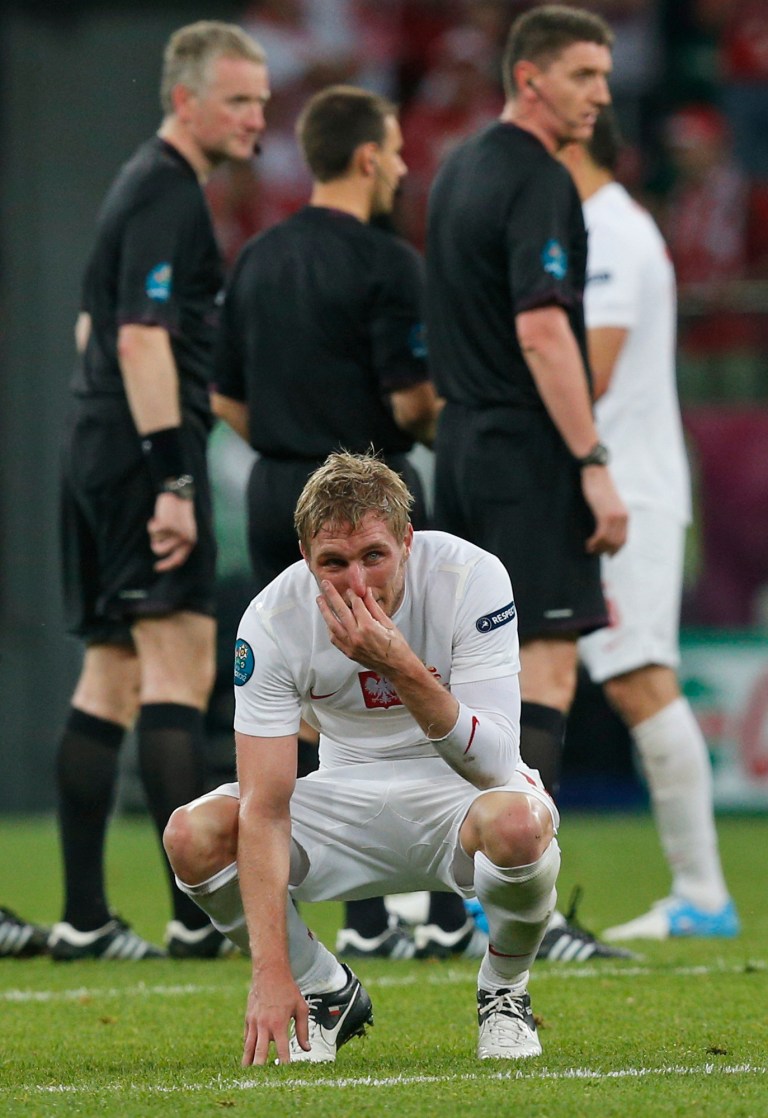   Poland's Damien Perquis reacts after losing the Euro 2012 soccer championship Group A match between Czech Republic and Poland in Wroclaw, Poland, Saturday, June 16, 2012. (AP Photo/Czarek Sokolowski)  