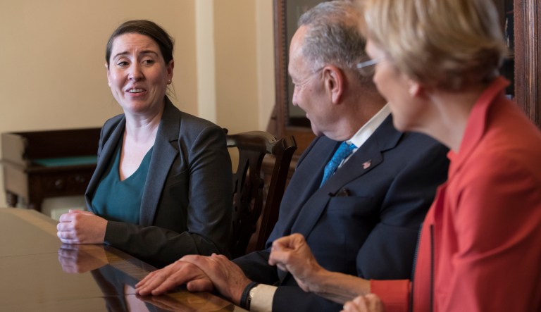 Leandra English, who was elevated to interim director of the Consumer Financial Protection Bureau by its outgoing director, met with Senate Minority Leader Chuck Schumer, D-N.Y., and Sen. Elizabeth Warren, D-Mass., on Monday to discuss the fight for control of the CFPB's fate. (AP Photo/J. Scott Applewhite)