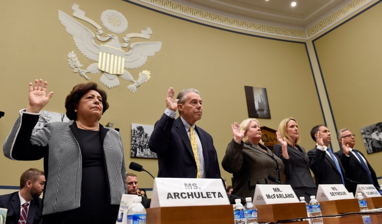 Office of Personnel Management Director Katherine Archuleta, left, and others, are sworn in on Capitol Hill in Washington, prior to testifying before the House Oversight and Government Reform Committee hearing on recent cyberattacks. From left are, Archuleta, OPM Inspector General Patrick E. McFarland, OPM Chief Information Officer Donna K. Seymour, Department of Homeland Security Computer Emergency Readiness Team Director Ann Barron-DiCamillo, KeyPoint Government Solutions Chief Executive Officer Eric A. Hess, and USIS Chief Information Officer Rob Giannetta. (AP Photo/Susan Walsh)