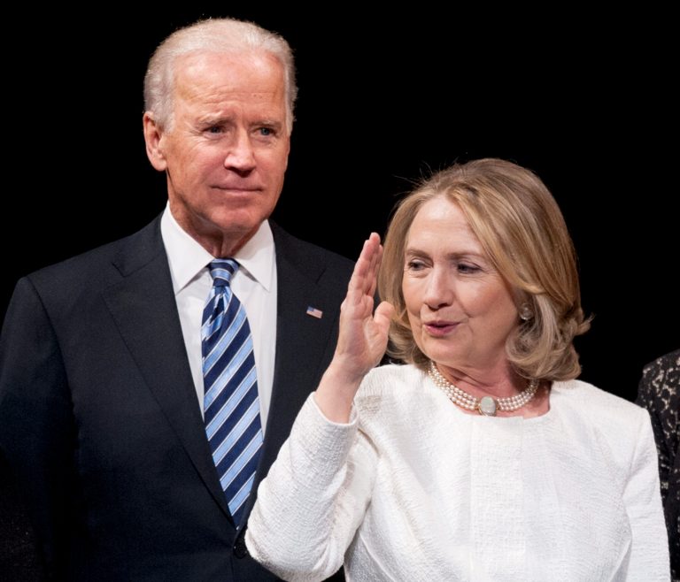 Joe Biden Hillary Clinton appear onstage at the Vital Voices Global Partnership 2013 Global Leadership Awards gala at the Kennedy Center for the Performing Arts in Washington, April 2, 2013. (AP Photo)Â 