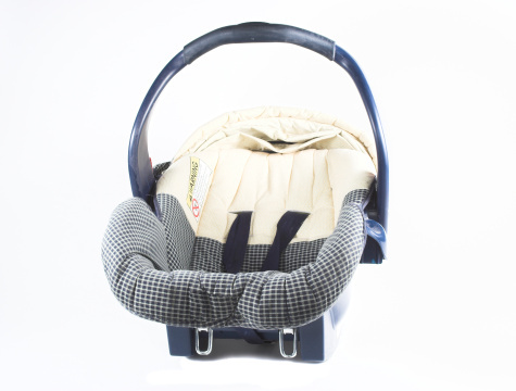 A woman was charged with knowingly attempting to export firearms after Transportation Security Administration officials found five firearms and firearm components concealed in a child booster seat in her checked baggage. (Photo: Thinkstock)