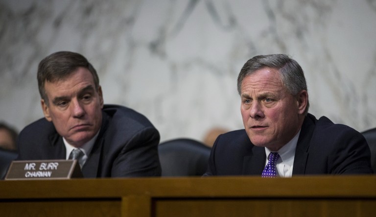 Chairman Sen. Richard Burr, R-N.C., right, speaks during a Senate Intelligence Committee hearing as Sen. Mark Warner listens.