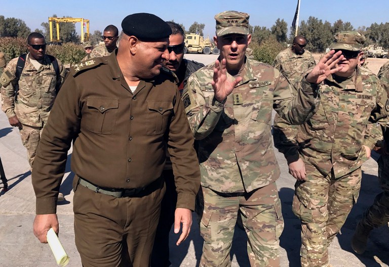 In this Wednesday, Feb. 8, 2017 file photo, U.S. Army Lt. Gen. Stephen Townsend talks with an Iraqi officer during a tour north of Baghdad, Iraq. Townsend said, 
