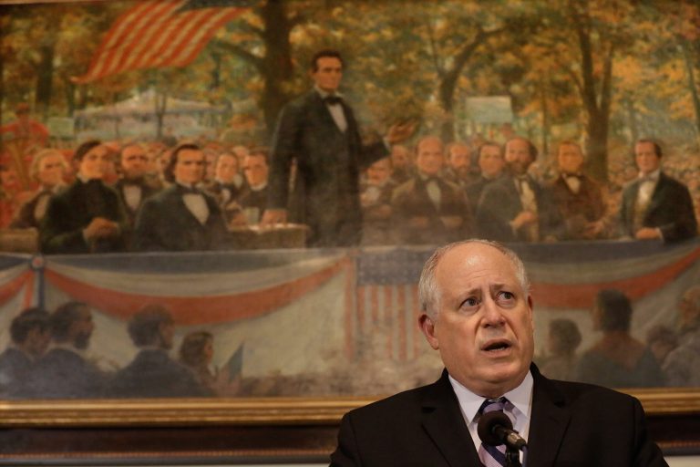 Illinois Gov. Pat Quinn speaks with reporters after pension legislation passed at the Illinois State Capitol on Dec. 3 in Springfield, Ill. (AP Photo/Seth Perlman)