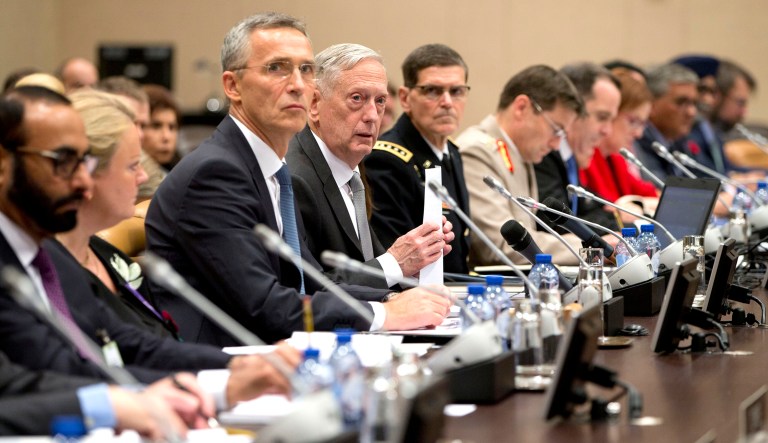 U.S. Secretary for Defense Jim Mattis, center right, and NATO Secretary General Jens Stoltenberg, center left, prepare to make the opening address during a round table meeting of NATO defense ministers and the Coalition to Defeat the Islamic State at NATO headquarters in Brussels on Thursday, Nov. 9, 2017. (AP Photo/Virginia Mayo, Pool)