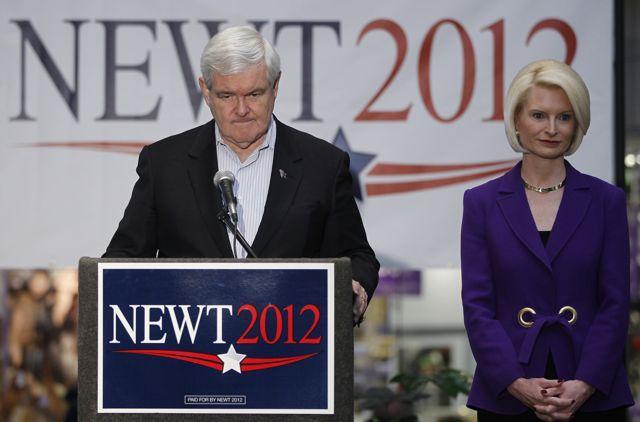 Republican presidential candidate, former House Speaker Newt Gingrich, stands with wife Callista as he makes a campaign stop at the Southbridge Mall in Mason City, Iowa, Wednesday, Dec. 28, 2011.