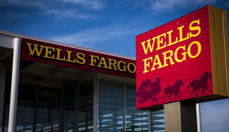 Signage is displayed outside a Wells Fargo & Co. bank branch in Niles, Ill., on July 10, 2018.