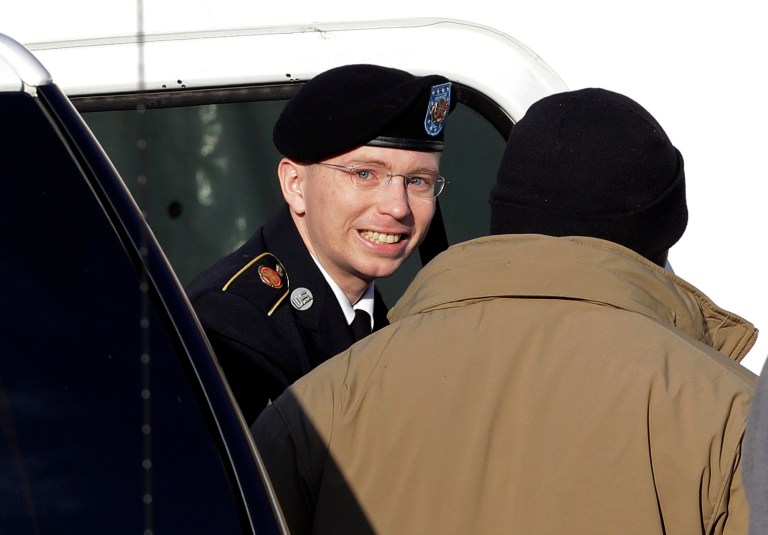   FILE - In this Nov. 28, 2012 file photo, Army Pfc. Bradley Manning, center, steps out of a security vehicle as he is escorted into a courthouse in Fort Meade, Md., for a pretrial hearing. A military judge hears closing arguments on Tuesday, Dec. 12, 2012, on whether a private charged with sending classified material to WikiLeaks suffered illegal pretrial punishment during nine months in a Marine Corps brig. Army Pfc. Bradley Manningâs lawyers claim his treatment was so egregious that all charges should be dismissed. (AP Photo/Patrick Semansky, HO)  