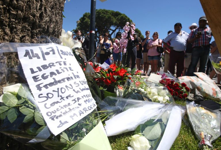 Floral tributes are laid out near the site of the truck attack in the French resort city of Nice, southern France. (AP Photo/Luca Bruno)