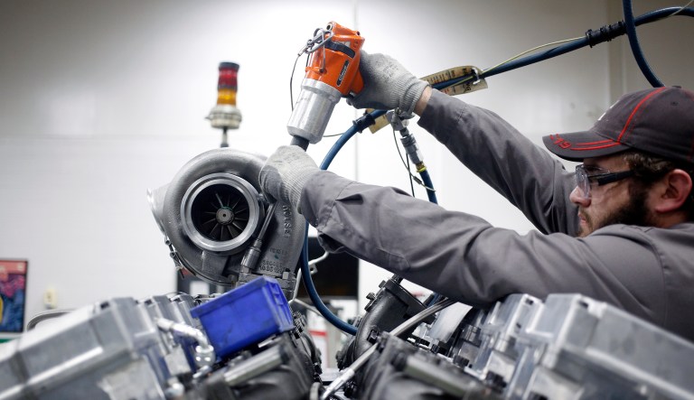 A worker uses a power drill to assemble components on a diesel engine at the Cummins Inc. Seymour Engine Plant in Seymour, Indiana, U.S., on Tuesday, Jan. 29, 2019. Cummins Inc. is scheduled to release earnings figures on February 6. 