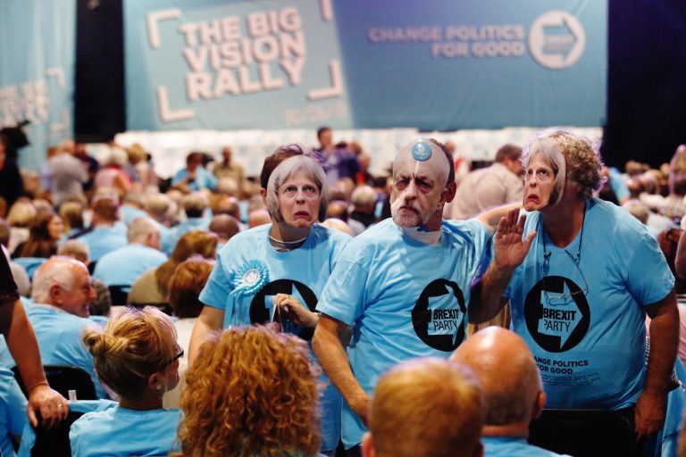 Supporters wear masks in the likeness of Theresa May and Jeremy Corbyn at the launch of Brexit Party's "The Big Vision" campaign in Birmingham, U.K. "If we don't leave on October 31, what you will see is the Brexit Party stunning everybody at the next general election," Brexit Party Leader Nigel Farage told the BBC in May. 