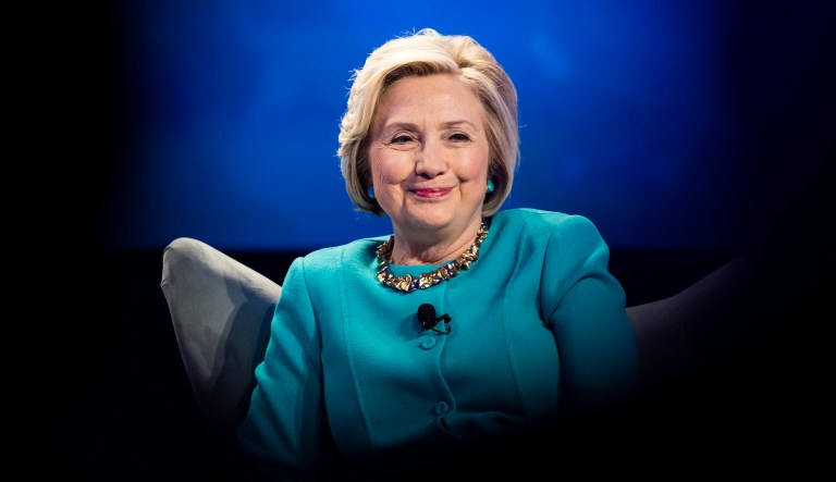 In Miami, a suspicious crate caused a brief shutdown at a local art fair. When it was opened, however, it turned out there was a painting of a pink-haired Hillary Clinton inside. (AP Photo/Matt Rourke)
