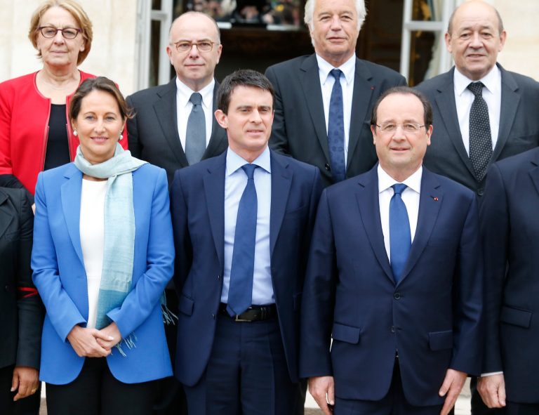 French President Francois Hollande, right front row,  new French Prime Minister Manuel Valls, center, and  Environment and Energy minister Segolene Royal pose during the family picture after the first weekly cabinet meeting after municipal elections, at the Elysee Palace in Paris, Friday, April 4, 2014. President Francois Hollande shook up the government this week after his Socialist Party suffered an electoral defeat in nationwide municipal elections. Among two new faces in the Cabinet is Segolene Royal, a longtime politician and mother of Hollande's children, as environment and energy minister. Second row are, from the left: Marylise Lebranchu, State Reform and Public Service minister, Bernard Cazeneuve, Interior Minister, Francois Rebsamen, Labor Minister, and Jean-Yves le Drian, Defense Minister. (AP Photo/Jacques Brinon)