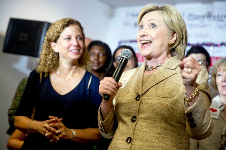 Democratic presidential candidate Hillary Clinton, right, stops in to speak to workers at a campaign office for Rep. Debbie Wasserman Schultz. (AP Photo/Andrew Harnik)