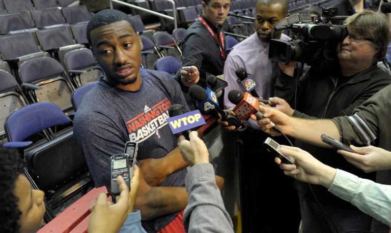   Washington Wizards point guard John Wall talks with the news media following a team practice at the Verizon Center in Washington, Monday, Dec. 17, 2012. Wall, the No. 1 overall pick in the 2010 draft, has been recovering from a stress injury to his left knee cap. AP Photo/Susan Walsh)  