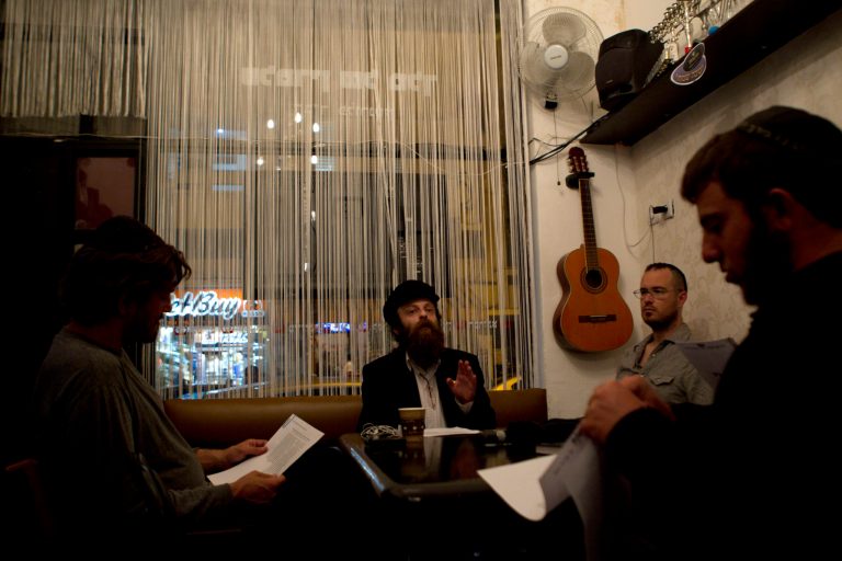   In this photo taken on Tuesday, Dec. 4, 2012, Shmuel Fortman Hapartzy, the Cain and Abel School for Prophets founder and teacher speaks to students in Tel Aviv, Israel. Instead of long beards and robes, they wear track suits and T-shirts. Their tablets are electronic, not hewn of stone, and they hold smartphones, not staffs. They may not look the part, but this ragtag group of Israelis is training to become the next generation of prophets. For just 200 shekels ($53) and in only 40 short classes, anyone can become a certified, modern-day soothsayer at the Cain and Abel School for Prophets.(AP Photo/Ariel Schalit)  