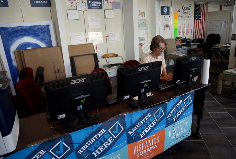 A campaign volunteer who asked not to be identified inputs voter registration data into a computer at a campaign office for President Barack Obama, Monday, Oct. 8, 2012 in Miami. (AP Photo/Lynne Sladky)
