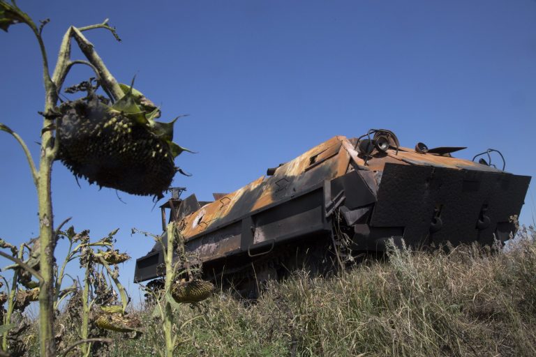 A pro-Russian fighters' APC stands abandoned near the city of Lisichansk, Luhansk region, eastern Ukraine Saturday, July 26, 2014. Volunteers from the Donbas Battalion, a volunteer militia for a united Ukraine, told The Associated Press their units, along with the Ukrainian army, regained control of Lisichansk on Friday. (AP Photo/Dmitry Lovetsky)