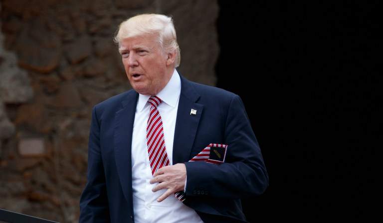 The storm surrounding the Trump administration raged on at home while the president notched successes abroad. (AP Photo/Evan Vucci)