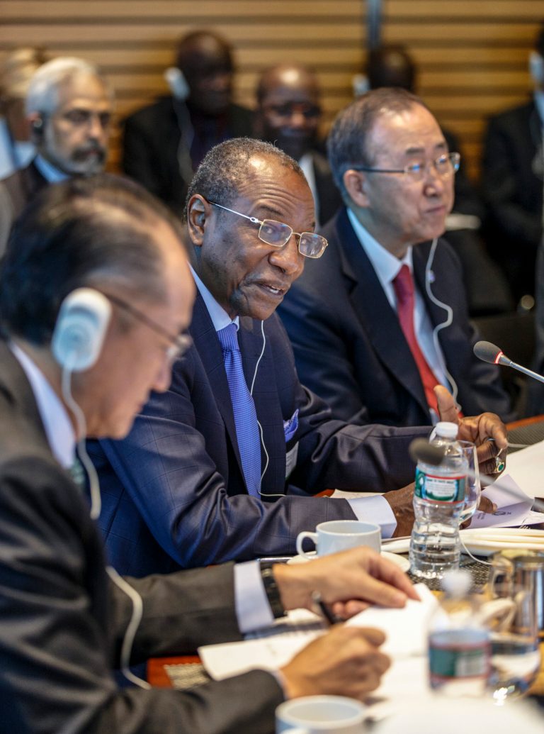 Guinean President Alpha Conde, center, flanked by World Bank President Jim Yong Kim, left, and United Nations Secretary General Ban Ki-moon, right, joins an international forum to discuss the Ebola outbreak and what help is needed by the West African nations that are stricken with the outbreak, at the World Bank in Washington, Thursday, Oct. 9, 2014.  (AP Photo/J. Scott Applewhite)