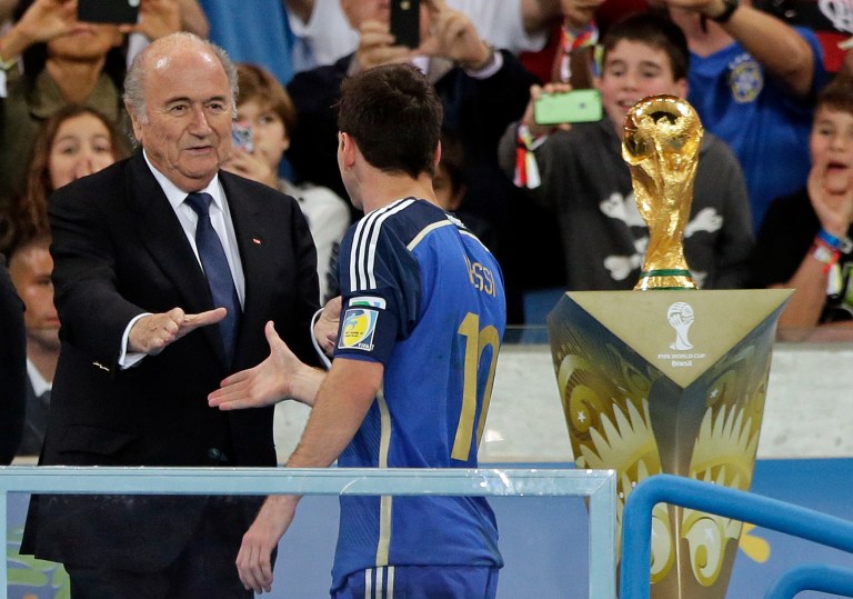 Argentina's Lionel Messi shakes hands with FIFA President Sepp Blatter after the World Cup final soccer match between Germany and Argentina at the Maracana Stadium in Rio de Janeiro, Brazil, Sunday, July 13, 2014. Germany won the match 1-0. (AP Photo/Matthias Schrader)