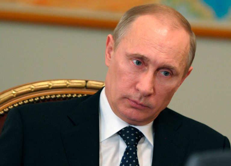 Russian President Vladimir Putin listens  during his working meetings at the Novo-Ogaryovo residence outside Moscow, Russia, Friday, Feb. 28, 2014. Moscow has been sending mixed signals about Ukraine but pledged to respect its territorial integrity. Russian President Vladimir Putin has long dreamed of pulling Ukraine, a country of 46 million people considered the cradle of Russian civilization, closer into Moscow's orbit. (AP Photo/RIA-Novosti Presidential Press Service, Alexei Nikolsky)