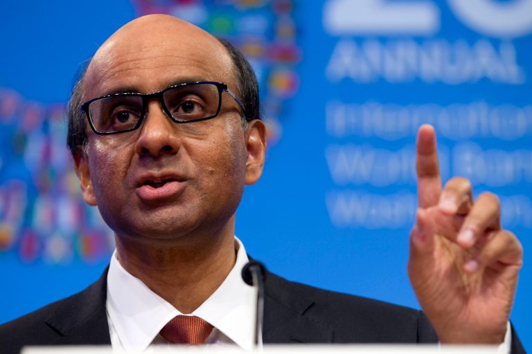 IMFC Chair and Singapore's Finance Minister Tharman Shanmugaratnam accompanied by International Monetary Fund (IMF) Managing Director Christine Lagarde speaks during a news conference at the World Bank Group-International Monetary Fund Annual Meetings at IMF headquarters in Washington, Saturday, Oct. 11, 2014.  (AP Photo/Jose Luis Magana)
