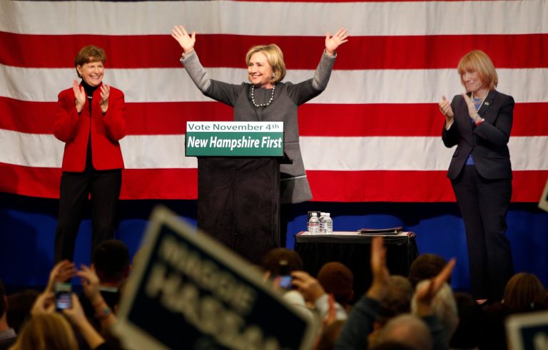 Hillary Clinton, center, joins U.S. Sen. Jeanne Shaheen, D-N.H., left, and Gov. Maggie Hassan, D-N.H., during a get out the vote rally, Sunday, Nov. 2, 2014 in Nashua. (AP Photo/Jim Cole)