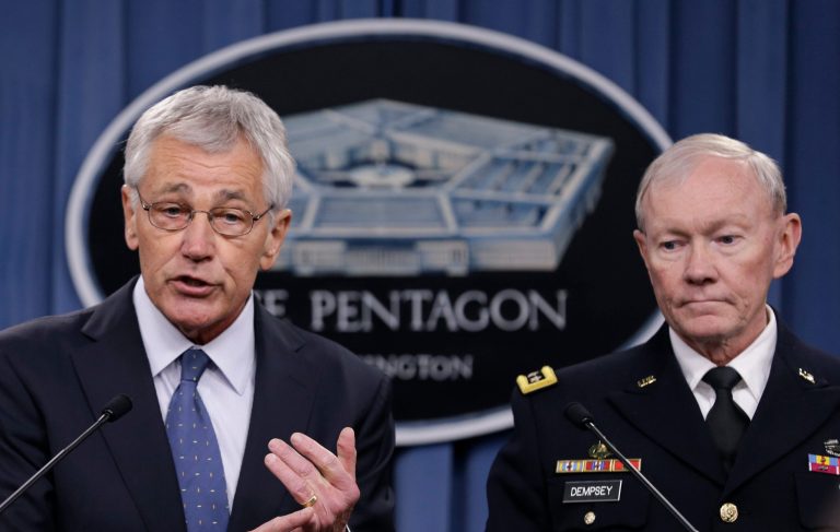Defense Secretary Chuck Hagel, accompanied by Joint Chiefs Chairman Gen. Martin Dempsey, briefs reporters at the Pentagon, Monday, Feb. 24, 2014, where he recommended shrinking the Army to its smallest size since the buildup to U.S. involvement in World War II in an effort to balance postwar defense needs with budget realities. (AP Photo/Carolyn Kaster)