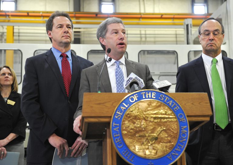 Larry Simpkins, CEO of the Washington Companies and co-chair of Main Street Montana, speaks at news conference, at Boeing Helena on Thursday, April 3, 2014 in Helena.   Simpkins, along with Governor Steve Bullock, left, and Bill Johnstone, CEO of D.A. Davidson and co-chair of the Project, gathered information from Montanans across the state in a series of roundtable discussions in order to boost job creation, encourage business expansion and improve wages in the state.   (AP Photo/The Independent Record, Eliza Wiley)