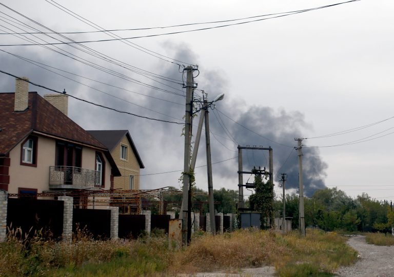 Smoke rises over a residential area in the north of the rebel-held city of Donetsk, eastern Ukraine, Monday, Sept. 22, 2014. A cease-fire was called on Sept. 5 but has been violated repeatedly. Negotiators from Ukraine, Russia, the rebels and the Organization for Security and Cooperation in Europe last week tried to further the peace process with an agreement calling for both sides to halt their advances and for pulling back heavy artillery in order to create a buffer zone. (AP Photo/Darko Vojinovic)