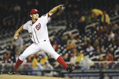 Jacquelyn Martin/AP
Stephen Strasburg had four strikeouts and no walks in five shutout innings in his season debut on Tuesday vs. the Dodgers.