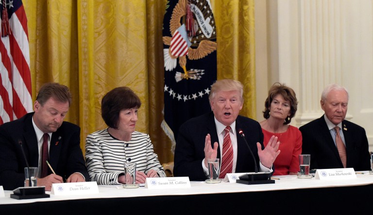 President Trump, center, told Republican senators this week that they should boost funding for healthcare in their bill to partially repeal Obamacare, in order to win more votes in the Senate and pass it when they return in July. (AP Photo/Susan Walsh)