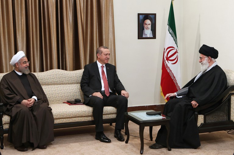 In this photo released by an official website of the Iranian Supreme Leader office, Supreme Leader Ayatollah Ali Khamenei, right, meets with Turkish President Recep Tayyip Erdogan, center, and Iranian President Hassan Rouhani, during their meeting in Tehran, Iran, Tuesday, April 7, 2015. (AP Photo/ Office of Iranian Supreme Leader)