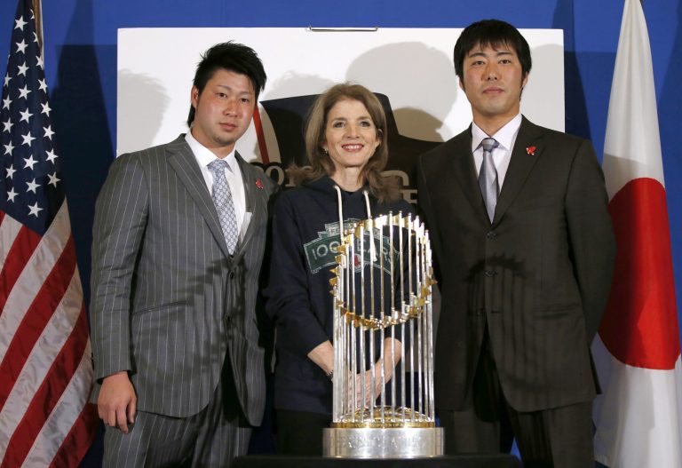 U.S. Ambassador to Japan Caroline Kennedy, center, Boston Red Sox pitchers Junichi Tazawa, left, and Koji Uehara pose for photos with the World Series trophy at the U.S. embassy in Tokyo, Tuesday, Jan. 21, 2014.  (AP Photo/Toru Hanai, Pool)