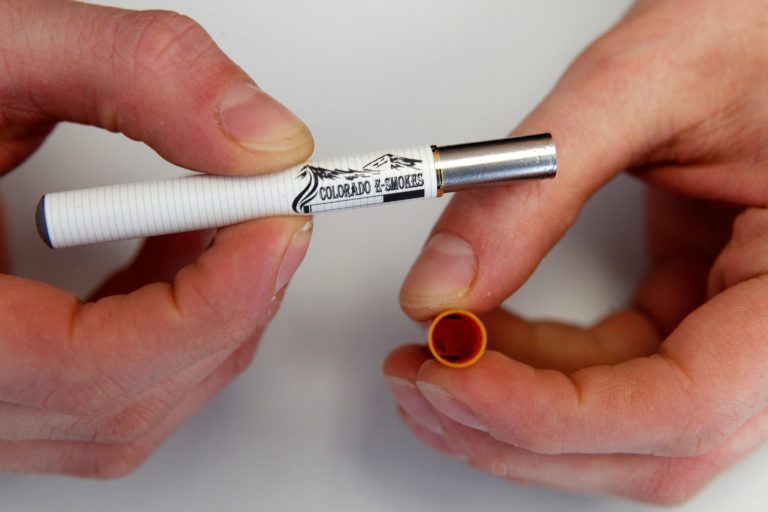 The Food and Drug Administration issued a final rule on Thursday outlining how it will regulate e-cigarettes and other products such as cigars and hookahs. (AP Photo/Ed Andrieski)
