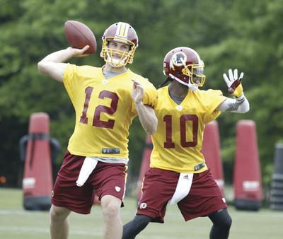Jennifer Milbrett/The Washington Examiner
The Redskins selected Kirk Cousins, left, in the fourth round after taking Robert Griffin III with the second overall pick in last month's NFL Draft.