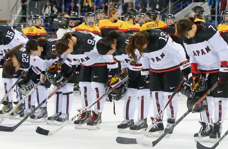 Members of team Japan bow after their 3-2 loss to Germany in the 2014 Winter Olympics women's ice hockey game at Shayba Arena, Tuesday, Feb. 18, 2014, in Sochi, Russia. (AP Photo/Matt Slocum)