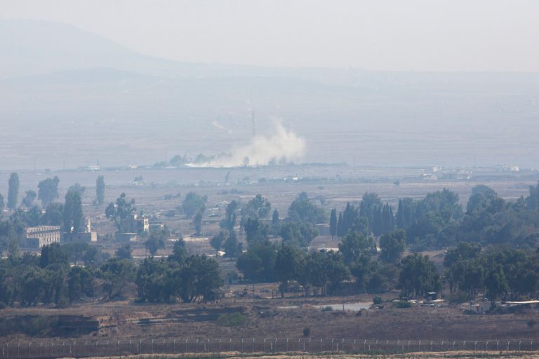 Smoke caused by fighting in Syria is seen from the Israeli-controlled Golan Heights, close to the border with Syria, Monday, Sept. 1, 2014. (AP Photo/Sebastian Scheiner)