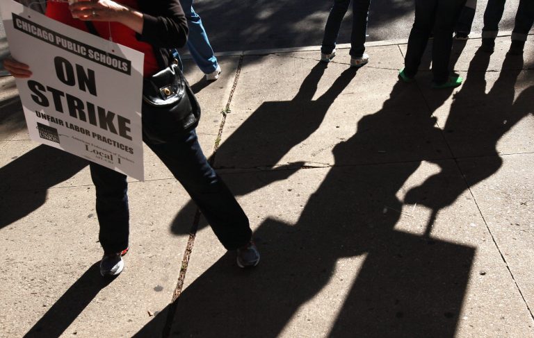 Chicago school teachers picket outside Wells High School on September 10, 2012 in Chicago, Illinois. (Photo by Scott Olson/Getty Images)