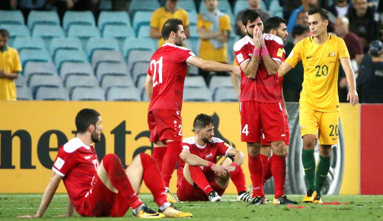 Syrian players react to their loss to Australia in their Soccer World Cup qualifying match in Sydney. (AP Photo/Rick Rycroft)