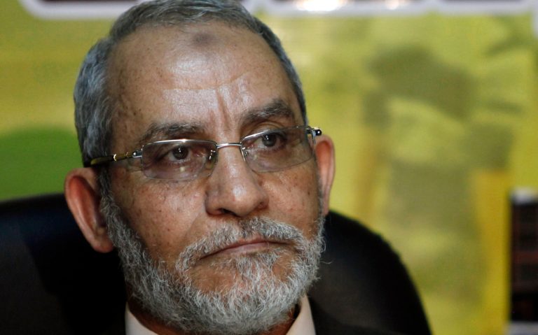 FILE - In this Tuesday, Nov. 30, 2010 file photo, Leader of Egypt's Muslim Brotherhood opposition group, Mohammed Badie attends a press conference at the group's parliamentary office in Cairo. Egyptian prosecutors have referred to trial the leader of the Muslim Brotherhood and 50 others on charges of inciting supporters to resist security forces during a deadly sweep against their sit-in protest in August. (AP Photo/Nasser Nasser, File)