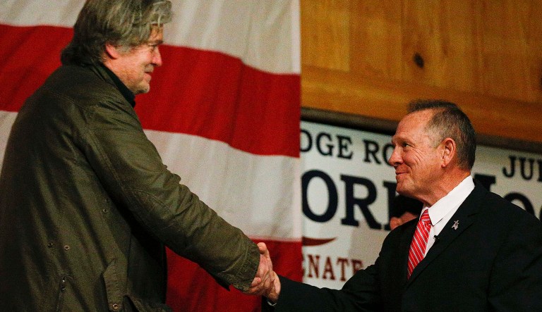 Bannon was nearly successful in dragging Moore to the finish line. (AP Photo/Brynn Anderson)