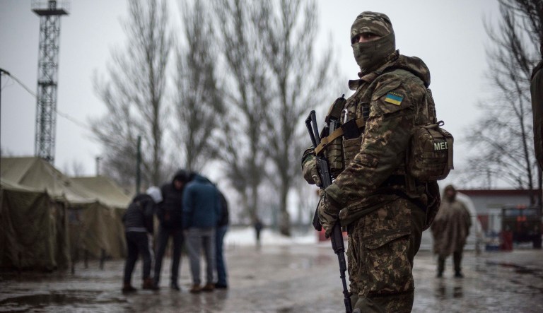 A Ukrainian serviceman patrols at the humanitarian aid center in Avdiivka, Ukraine, Saturday, Feb. 4, 2017. A report Wednesday says the State Department approved a commercial license that would permit items such as Model M107A1 Sniper Systems, ammunition, and associated parts and accessories to be exported to Ukraine. And former Obama administration official Michael Carpenter lauded Secretary of Defense Jim Mattis for his role in the decision on Twitter. (AP Photo/Evgeniy Maloletka)
