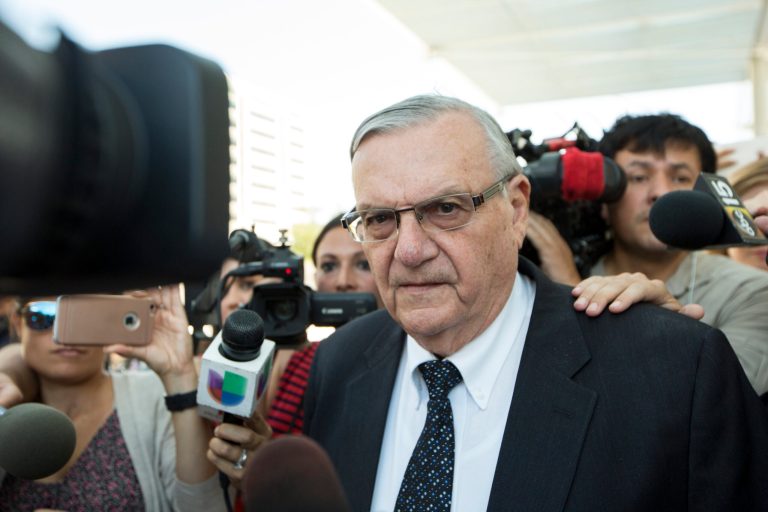 FILE- In this July 6, 2017, file photo, former Sheriff Joe Arpaio leaves the federal courthouse in Phoenix, Ariz. A federal lawsuit set to go to trial Dec. 2017, marks the latest in a series of legal actions brought against Arpaio based on allegations that he pursued a trumped-up criminal case to get publicity and embarrass an adversary. The malicious-prosecution lawsuit was filed by one of Sen. Jeff Flake's sons, who alleges Arpaio pursued felony animal cruelty charges against him and his then-wife in a bid to do political damage to the senator and garner publicity for the lawman. (AP Photo/Angie Wang, File)