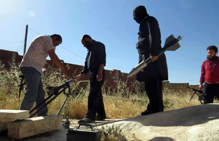 There's bipartisan accord that the administration must do more to get weapons into the hands of moderates fighting the Assad regime, even as the U.S. seeks to peacefully eliminate Syria's stockpile of chemical weapons. (AP File)
