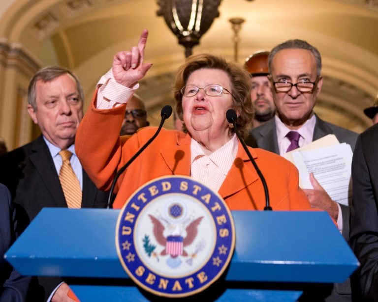 FILE - This Aug. 1, 2013, file photo shows Senate Appropriations Committee Chair  Sen. Barbara Mikulski, D-Md., flanked by Senate Majority Whip Richard Durbin of Ill., left, and Sen. Charles Schumer, D-N.Y., speaking on Capitol Hill in Washington.  Top congressional negotiators released on Jan. 13, 2014, a bipartisan $1.1 trillion spending bill that would pay for the operations of government through October and finally put to rest the bitter budget battles of last year. The 1,582-page bill was released after weeks of negotiations between House Appropriations Committee Chairman Harold Rogers, R-Ky., and Senate counterpart Mikulski, who kept a tight lid on the details. (AP Photo/J. Scott Applewhite, File)