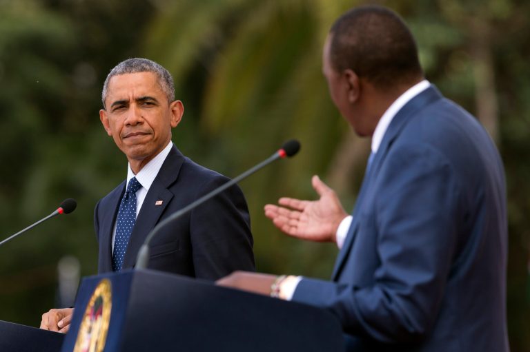President Barack Obama, left, listens as Kenyan President Uhuru Kenyatta speaks during a news conference at State House, on Saturday, July 25, 2015, in Nairobi, Kenya. (AP Photo/Evan Vucci)